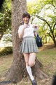 Leaning against tree in uniform