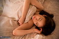Kitagawa yuzu under covers naked arm folded across her chest