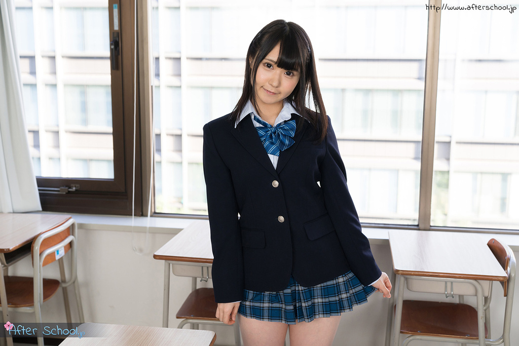 Playing with skirt hem in student uniform