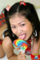 Nina licking lollipop