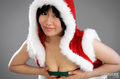 Leaning forward squeezing breasts together red santa costume