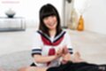 Teasing cock head on her knees in uniform