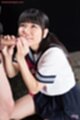 On her knees wearing kogal uniform teasing cock