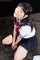 Kogal kneeling face upturned hands clasped between her thighs face glazed with cum