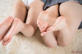 Students Ena Nishino and Momo Momoi giving footjob together