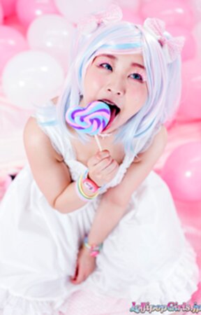 Minano Ai on her knees sucking lolipop and cock