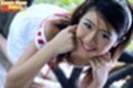 On all fours face resting on hands strap of striped top falling from bare shoulder