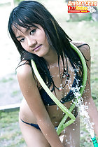 Hose around her shoulders long hair in bikini