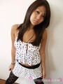 Christine chan wearing polka dot dress long auburn hair
