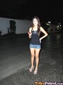 Filipina rhian standing in street in black top and denim shorts